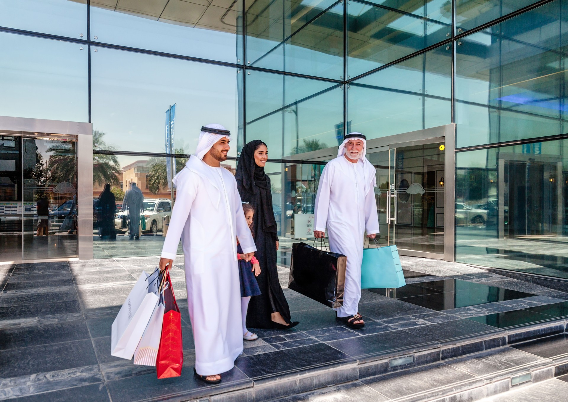 Arabian family walking after a successful shopping